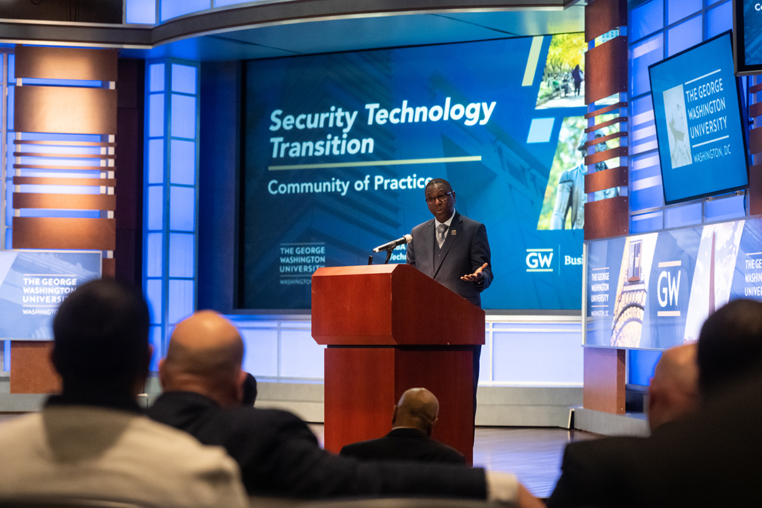 attendees listen to a presentation at the MBA in Security Technology Transition Community of Practice event