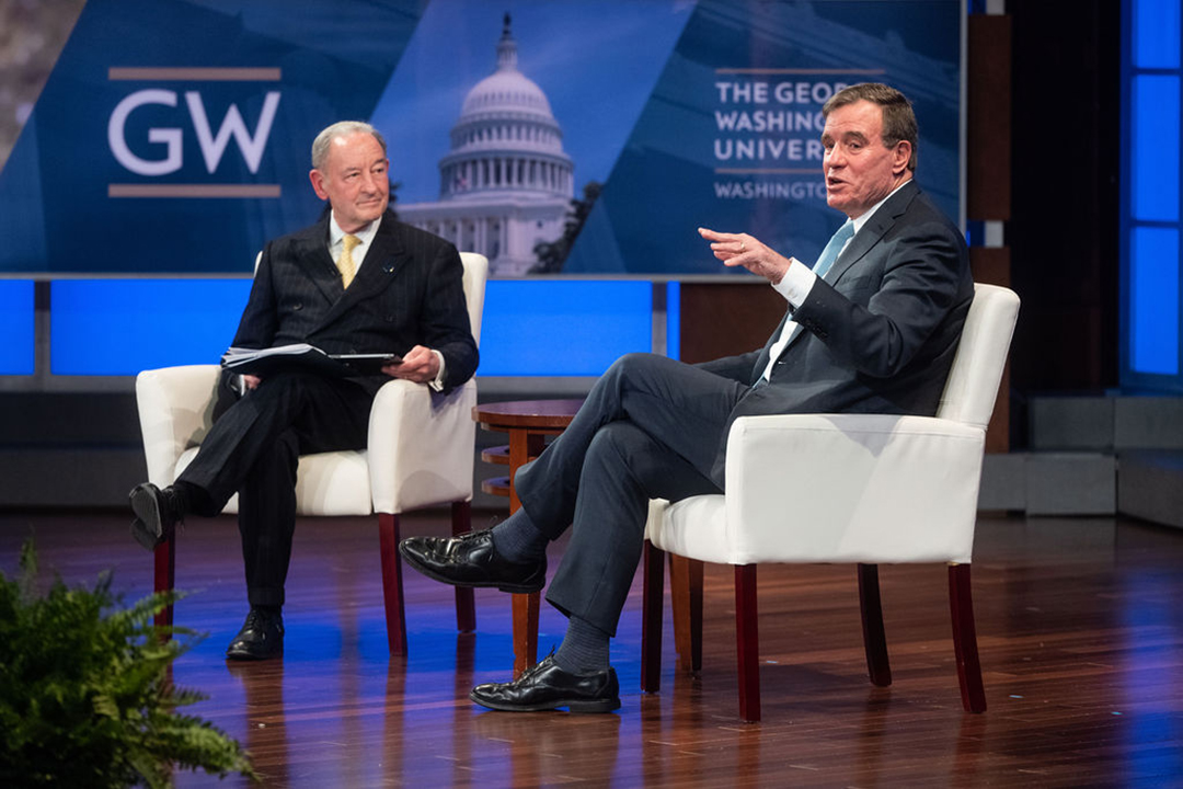 Sen. Mark Warner (D-Virginia), B.A. ’77, and GW President Mark S. Wrighton. (Linnea Farnsworth)