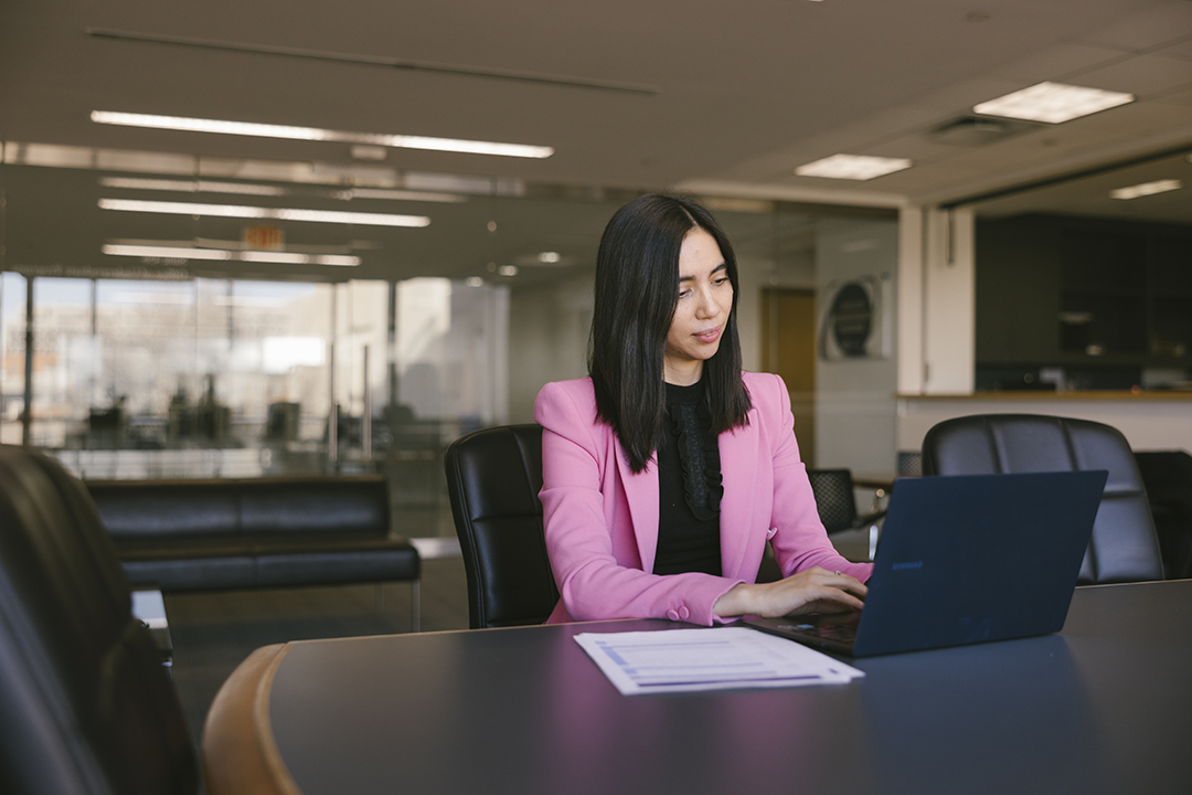 a GWSB Master of Accountancy student works at a laptop