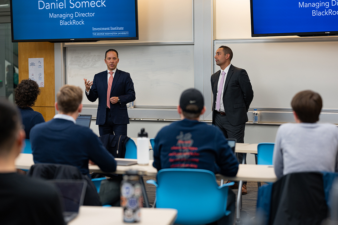 Alumni Oscar Pulido (l) and Dan Someck, both of BlackRock, spoke to GWSB Professor Rodney Lake's Applied Financial Securities Analysis class on Nov. 30. (Photo by Kate Woods)