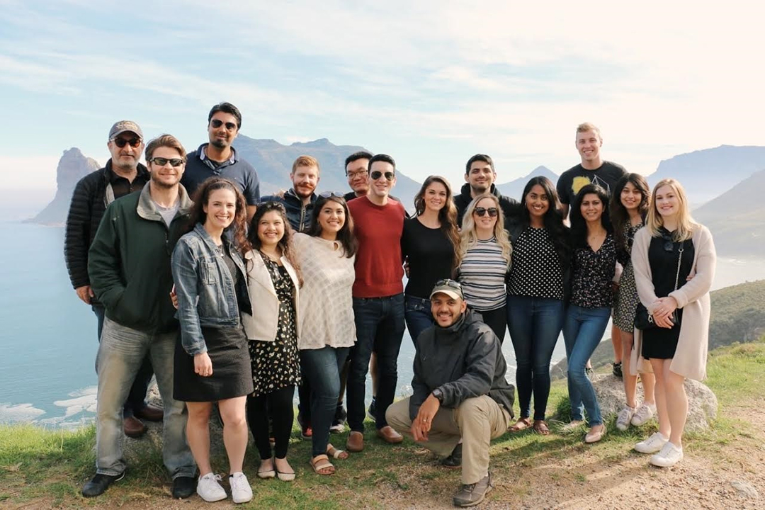GWSB Consulting Abroad Program students pose for a photo on a mountaintop in South Africa