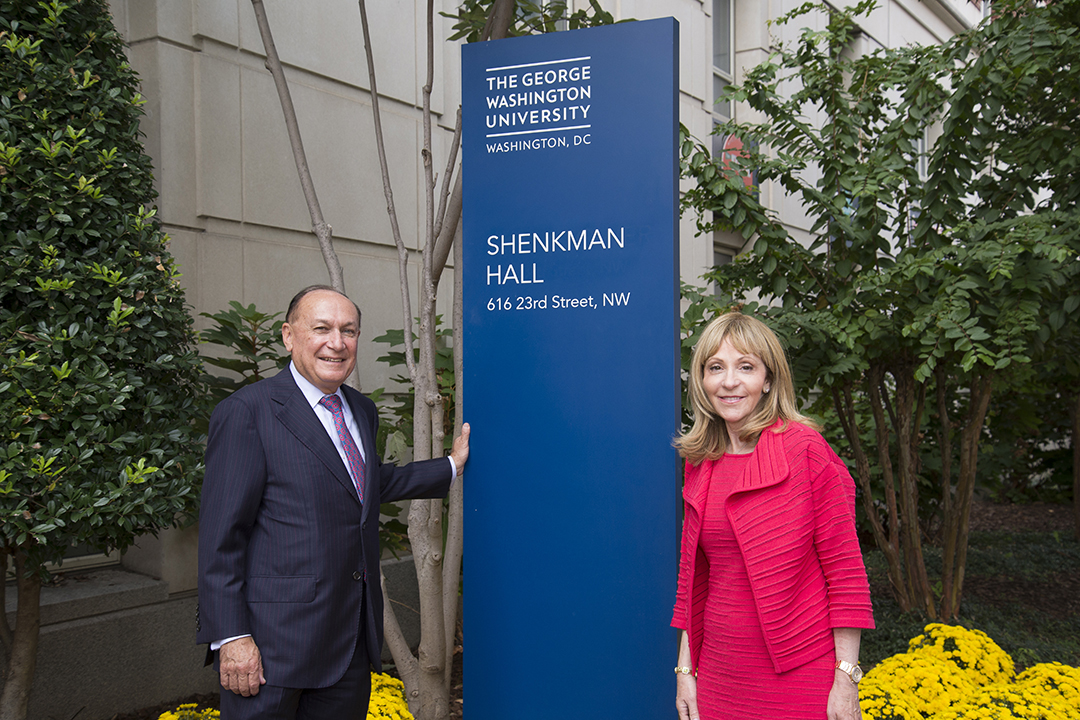 Alumnus Mark Shenkman and his wife, Rosalind, stand outside of his namesake residence hall on the Foggy Bottom campus. (photo: Development and Alumni Relations)