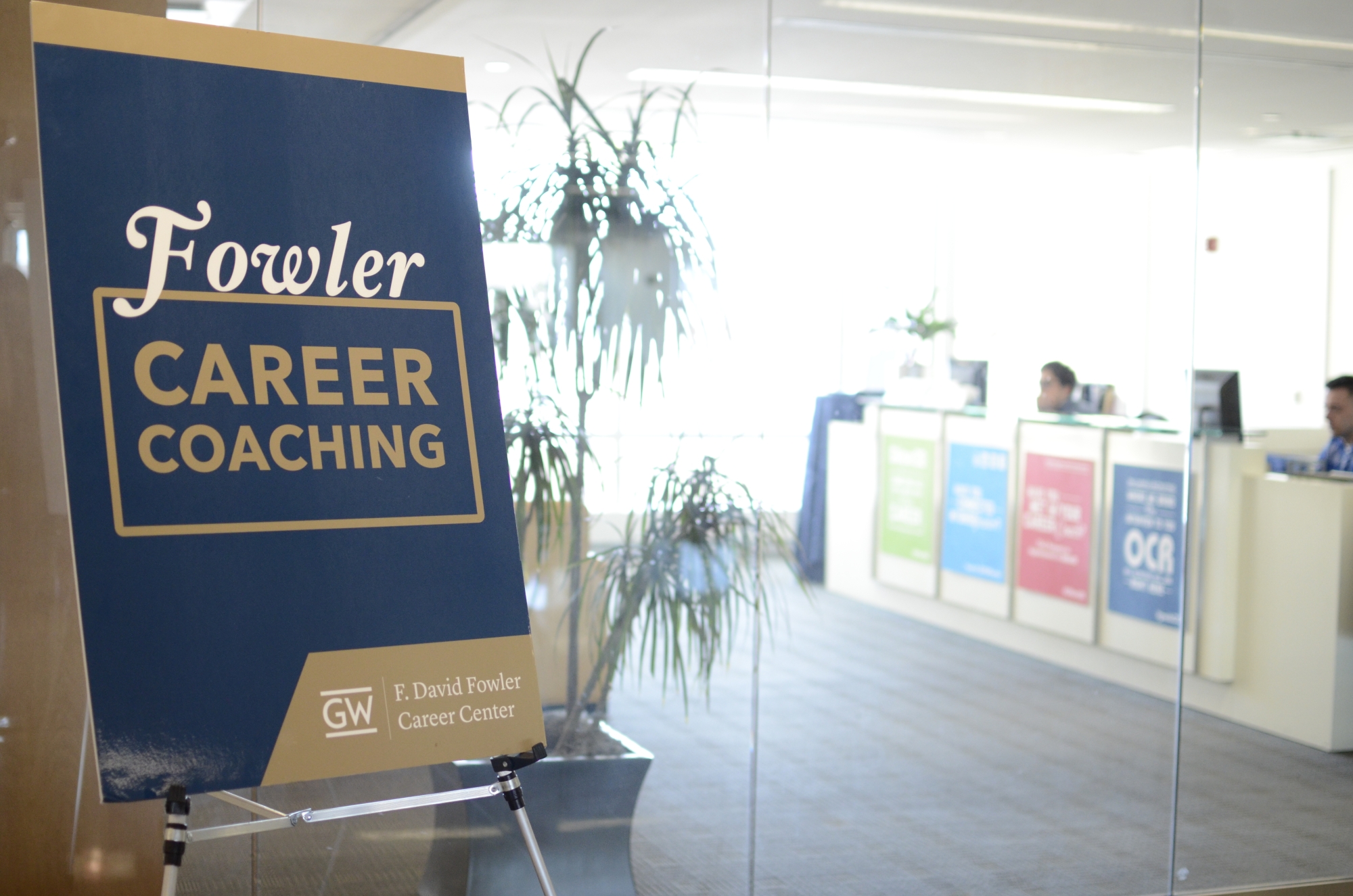 looking through glass doors into the Fowler Career Center suite at the School of Business