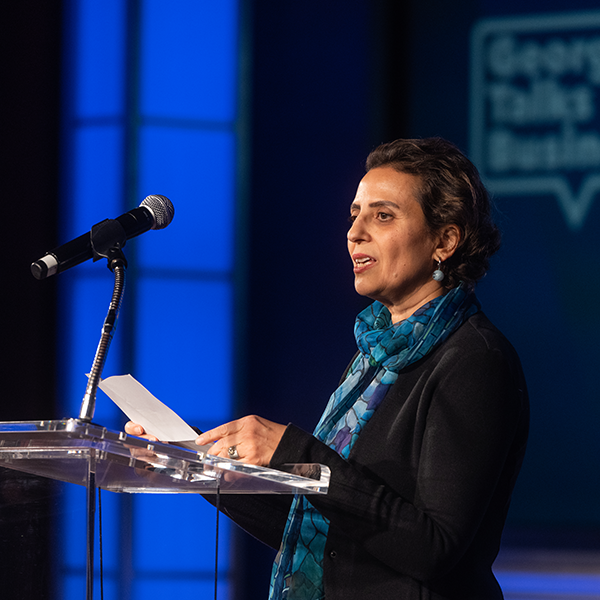 Senay Agca speaking at podium