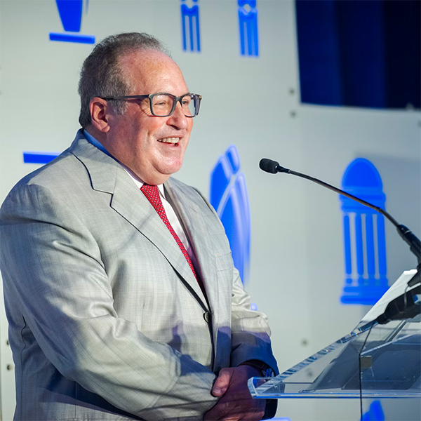 James Small, B.A. ’84 speaking at podium