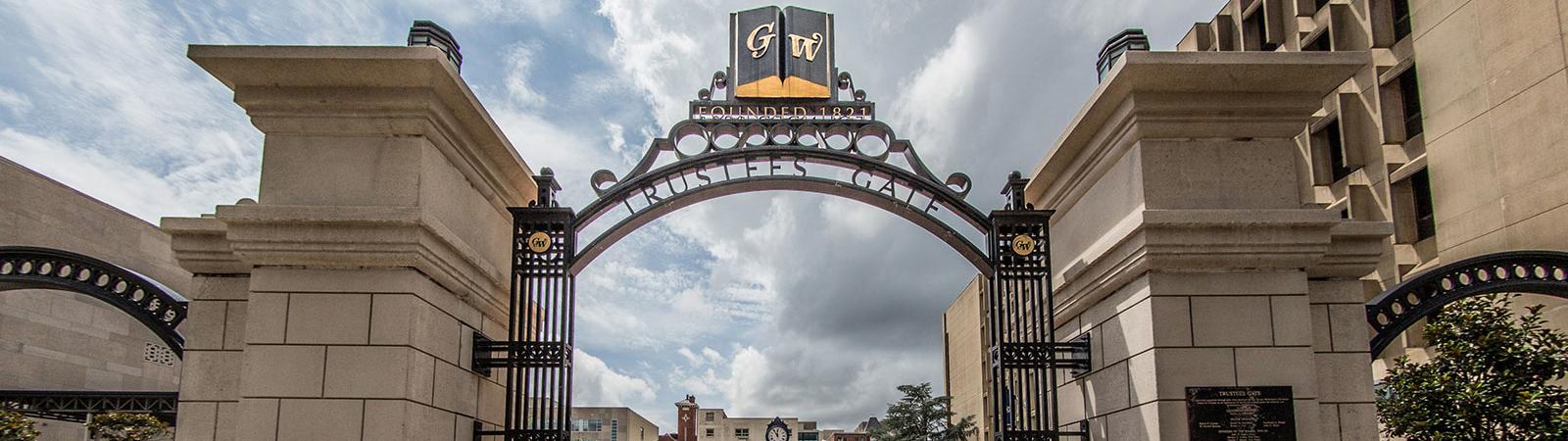 a view looking up at the Trustees Gate in Kogan Plaza on the GW University campus 